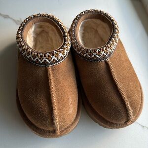 Toddler Ugg slides. Size 7 toddler. Worn once inside. Too small. Runs small.